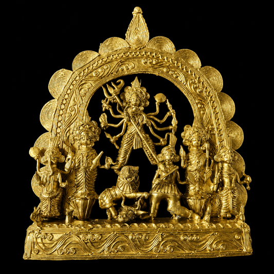 Dokra Durga idol with metallic finish against a black background