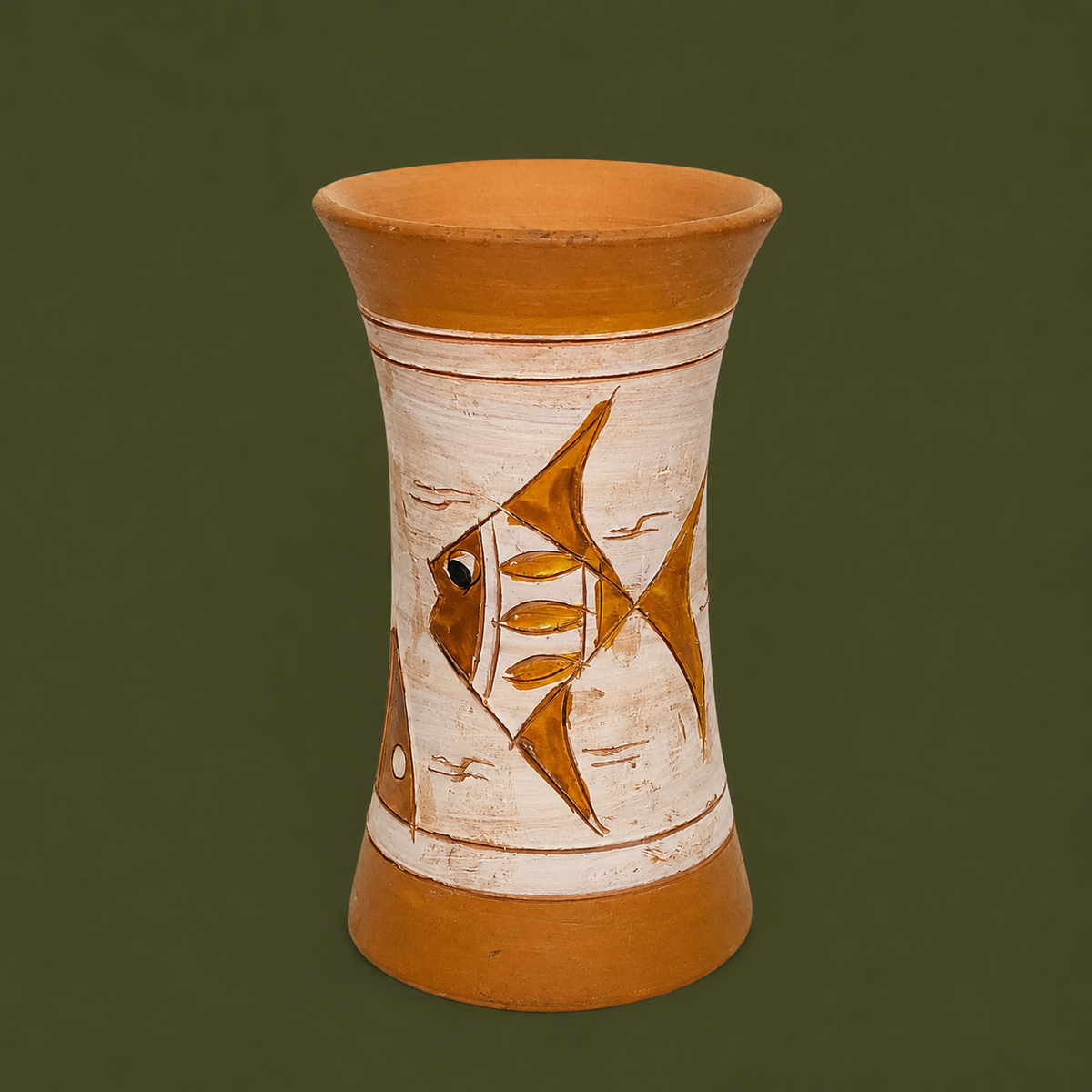A handmade terracotta vase with a hand-painted fish design on the front, set against a solid dark olive green background.